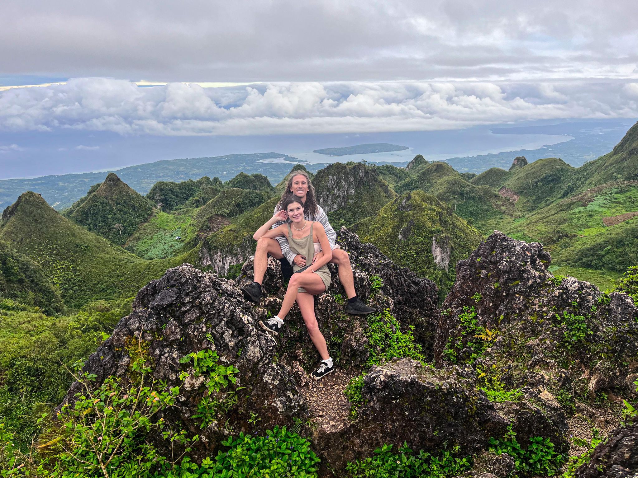 the owners of korduroy kidz on top of a mountain with pinicles throughout the background
