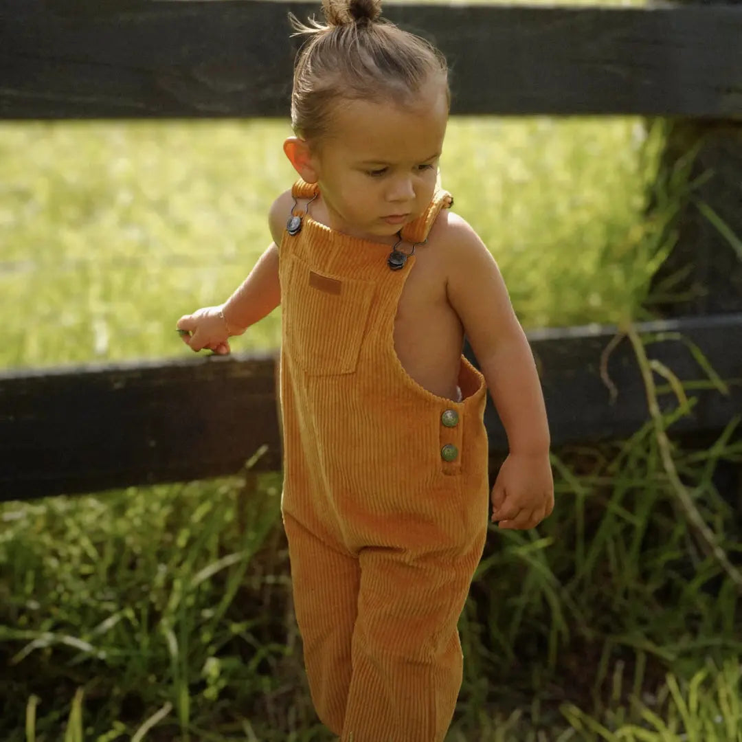 organic cotton corduroy long leg overalls in a orange for kids, toddlers and infants other side view
