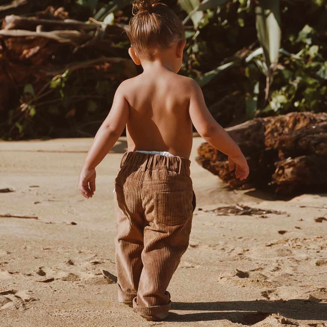 organic cotton corduroy pants in colour tan for infants, toddlers and kids back view