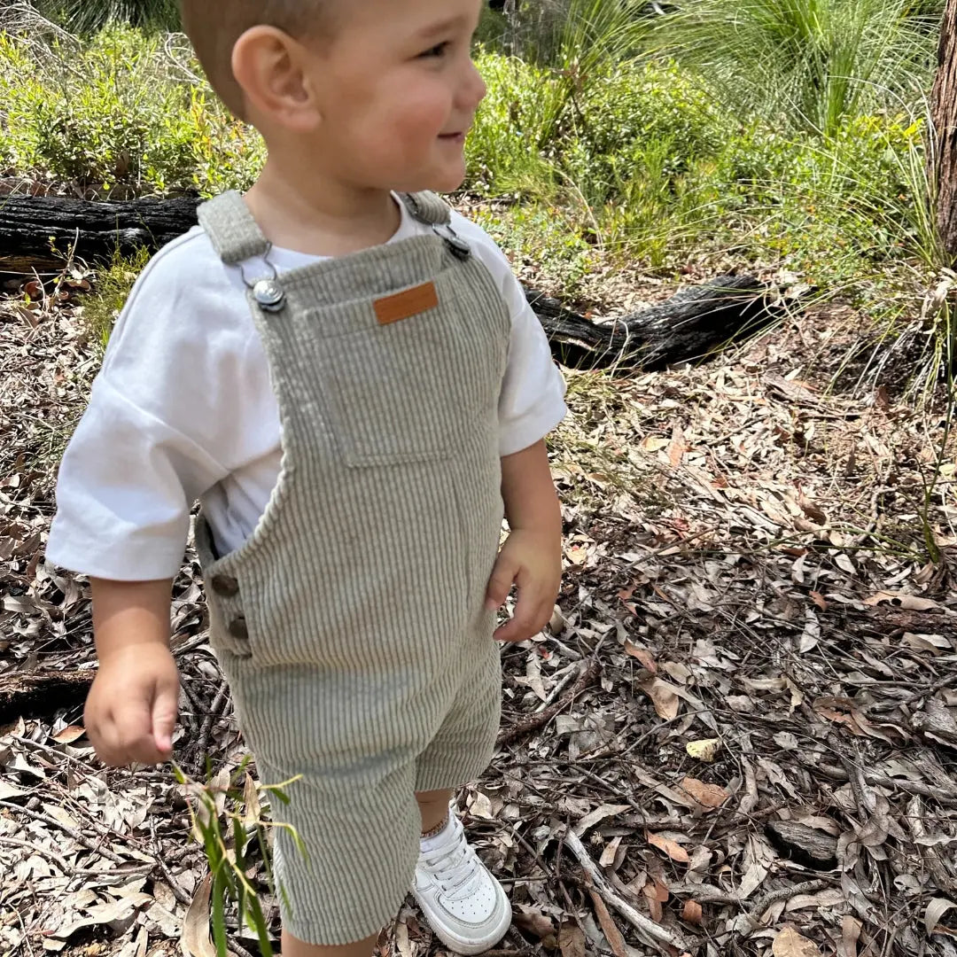 short leg overall, dungaree in colour sage made from organic cotton corduroy clothing for infants, toddlers and kids