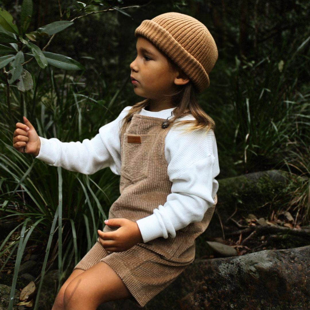 short leg overall, dungaree in colour tan made from organic cotton corduroy clothing for infants, toddlers and kids