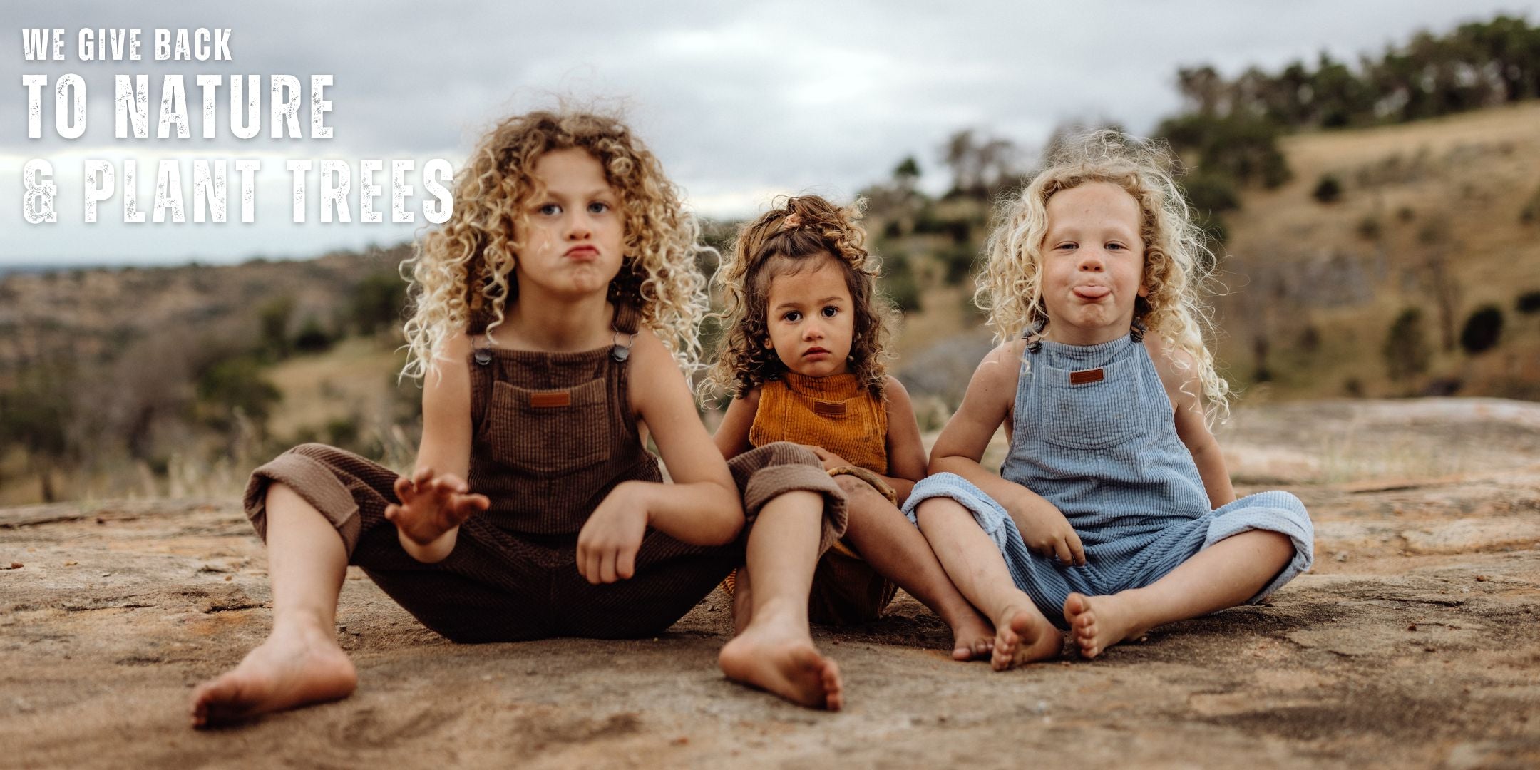 3 kids wearing organic cotton corduroy overalls. Long straight leg overalls and dungarees for kids, toddlers both boys and girls