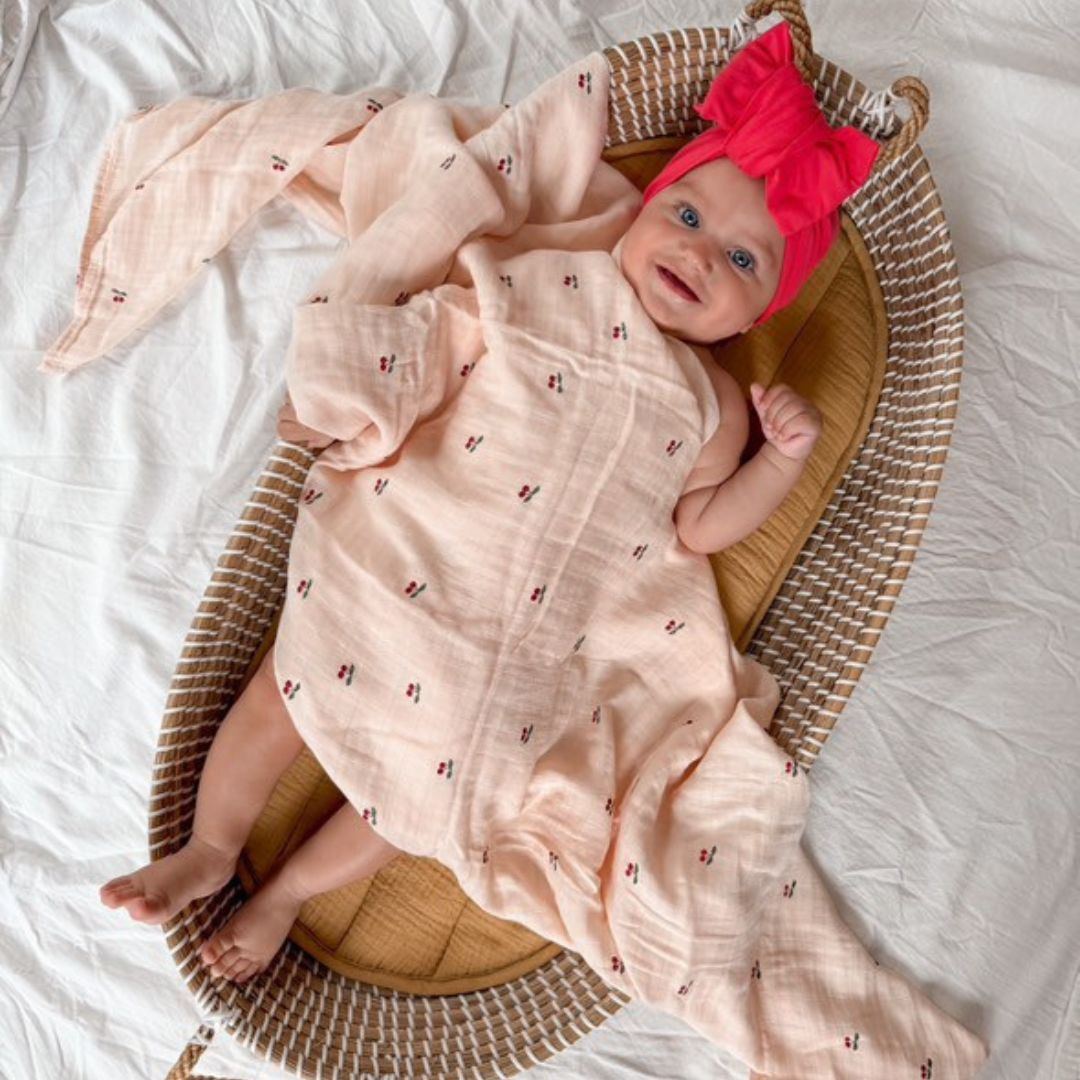 Organic Cotton and Bamboo Cherry Blossom Swaddle for babies. Size 120cm by 120cm. Comfort for babies side view
