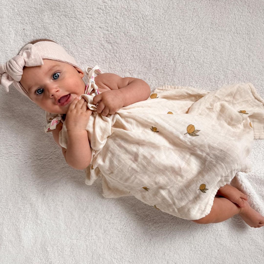 Organic Cotton and Bamboo Lemon Blossom Swaddle for babies. Size 120cm by 120cm. Comfort for babies side view
