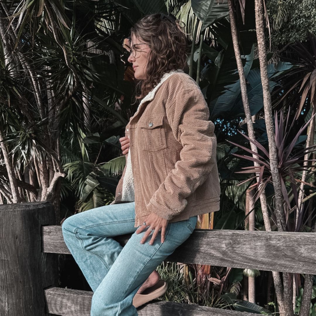 women wearing her corduroy sherpa fleece jacket similar to a wool jacket
