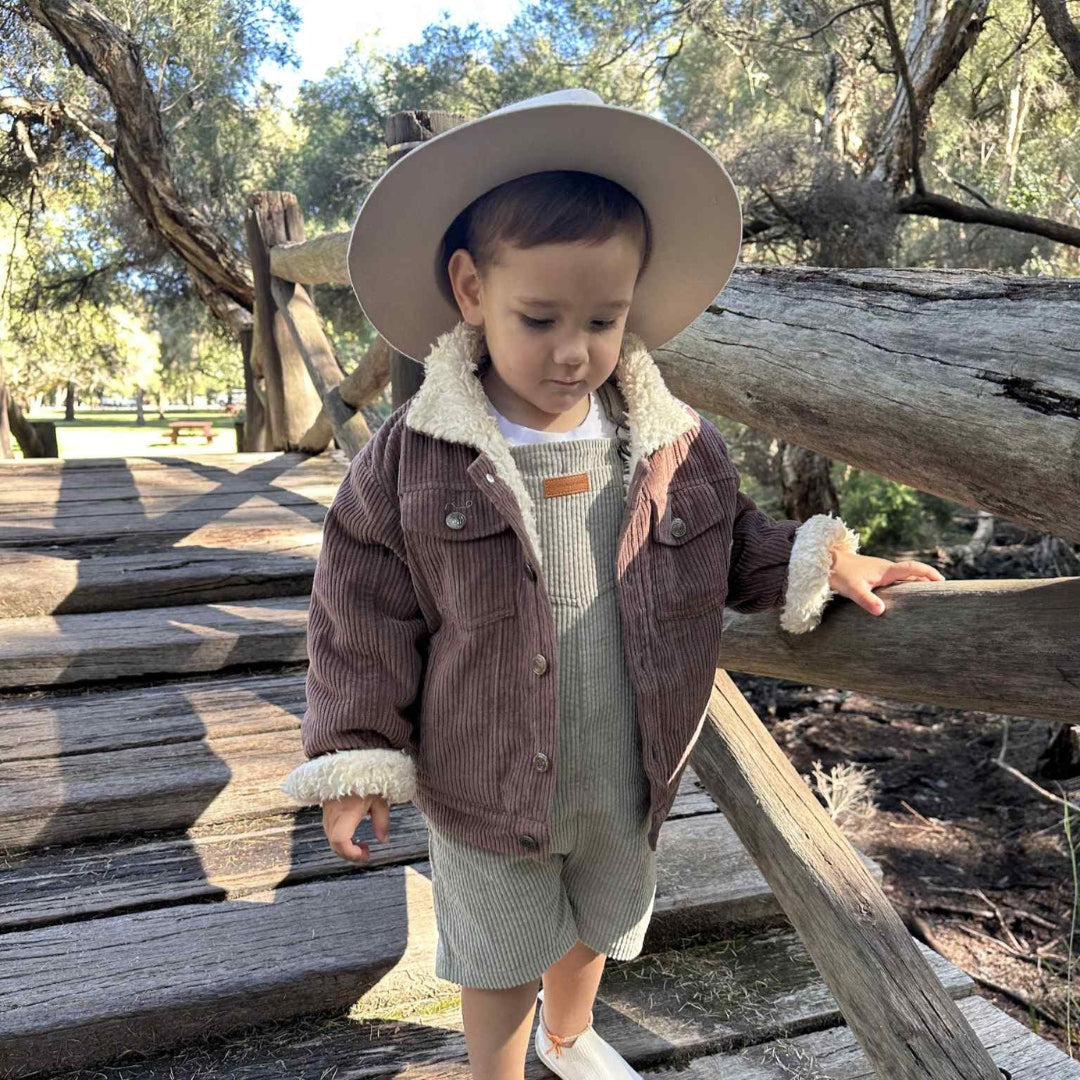 infants, toddlers and kids organic cotton corduroy jacket in a brown colour front view....