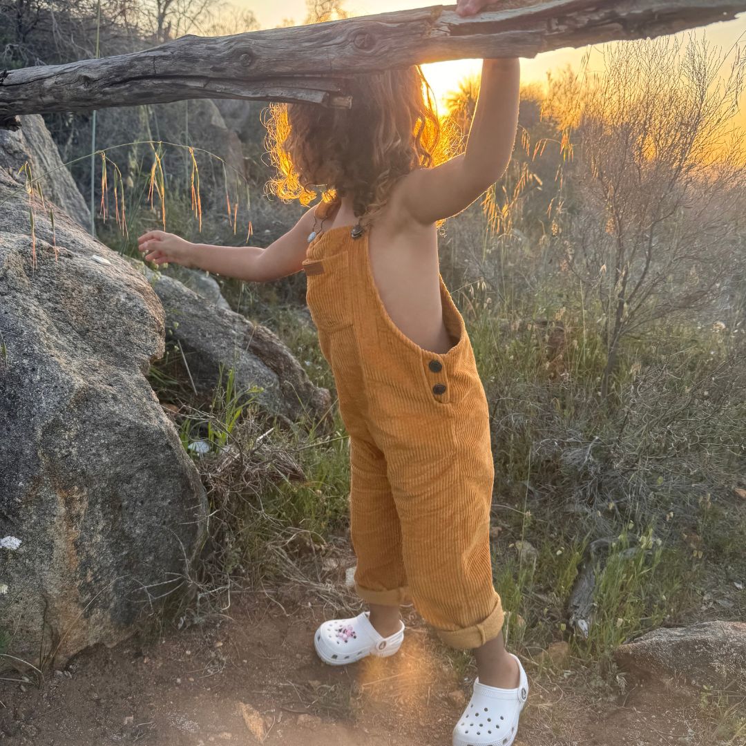 organic cotton corduroy long leg overalls in a orange for kids, toddlers and infants side view