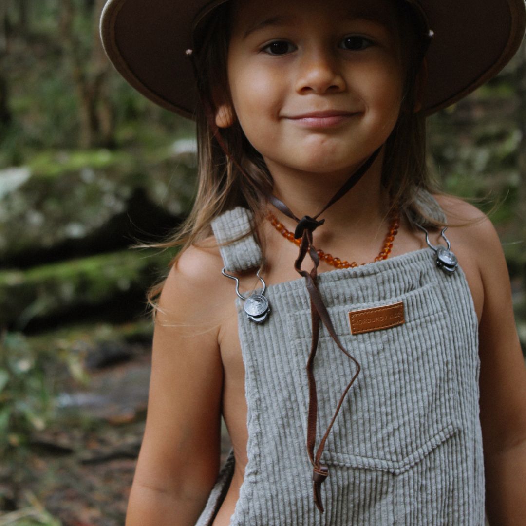 organic cotton corduroy short leg overalls in a sage for kids, toddlers and infants front close up