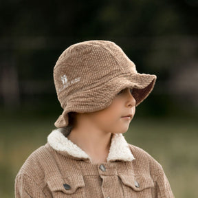 boy wearing his Kids and toddlers tan colour corduroy bucket hat